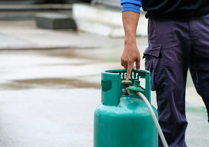 lpg bottle being handled by staff 1
